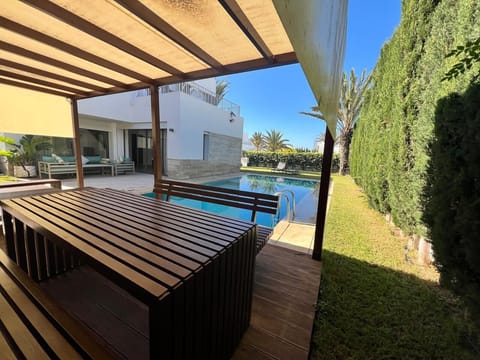 Private swimming pool surrounded by a lush garden. Perfect for relaxing . 