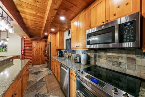 Cozy rustic kitchen with modern appliances and warm wood accents