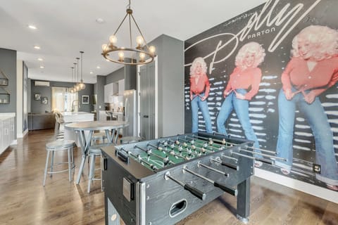Foosball table in main living space for easy in-house entertainment