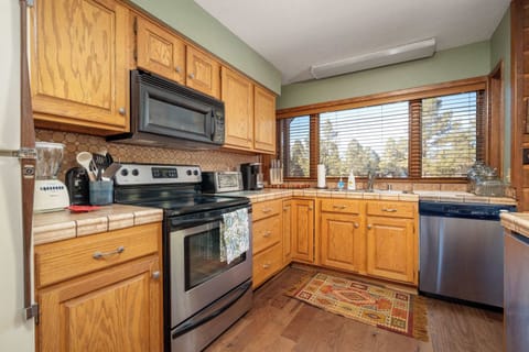 Bright, spacious, and stylish, this kitchen makes cooking, chatting, and making memories a seamless and fun experience for everyone.
