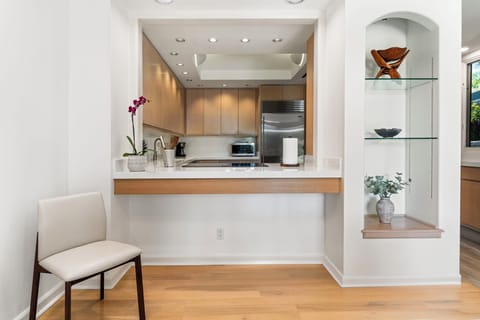 Designed for home chefs and extended stays, the gourmet kitchen is both stylish and highly functional