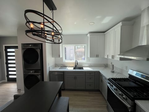 Washer and Dryer, dining bar/work area includes charging outlets.