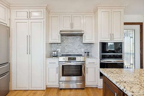  Cook up a storm in this sleek space with granite counters and top-notch appliances!