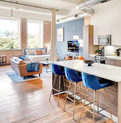 OPen, Bright Kitchen into dining space with vaulted loft ceilings.
