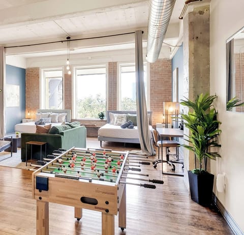 A seamless open-concept - Sun-filled downtown Dallas loft with industrial character.