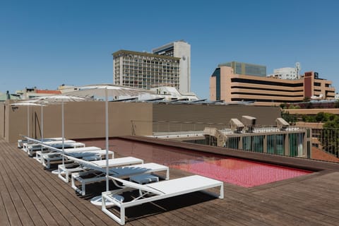 Dive into a stunning rooftop pool with skyline views.