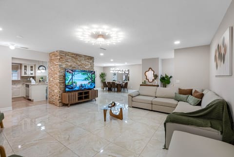 Large living room designed for group lounging and movie nights