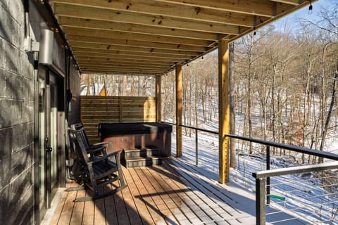 Relax in the private hot tub tucked beneath the deck allowing relaxation in all weatheror gather around the nearby fire pit for cozy evenings and conversation in the fresh air.