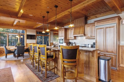 Open-concept kitchen and dining area designed for group gatherings