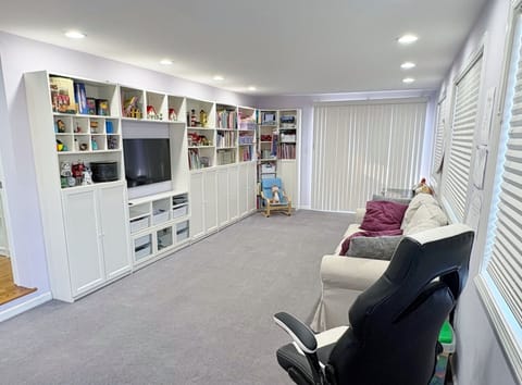 Family room stocked with toys and children's books.