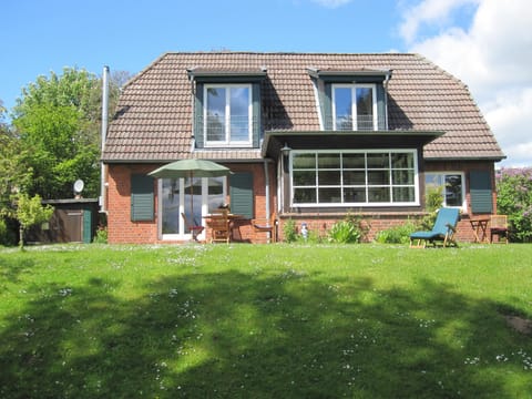 Experience this charming house with an inviting garden.