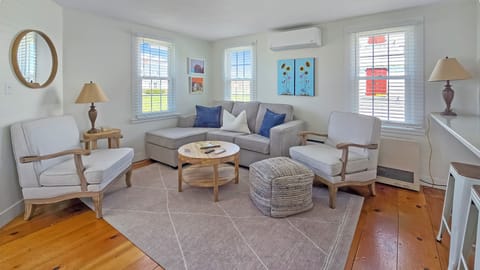 Living room with comfortable seating and large flat screen TV