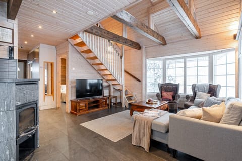 A cozy fireplace corner invites you to relax after a day spent outdoors