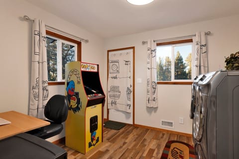 Convenient on-site laundry nook with washer and dryer, making longer stays easy and comfortable—perfect for refreshing clothes after mountain adventures or extended getaways. + An arcade game.