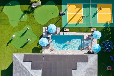 Resort-style backyard with pool, pickleball, and putting greens