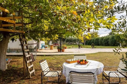 Dine al fresco beneath the trees in your private garden oasis