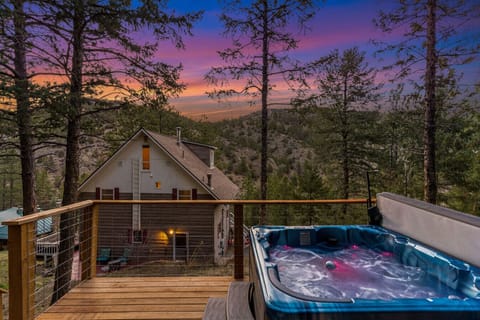 Enjoy the private hot tub overlooking the mountains