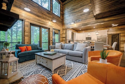 Living Room: Sunlit retreat with rustic charm, perfect for relaxation or fun gatherings!