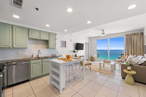 The Coral Cowboy features an open floor plan where the beautiful views of the ocean can be enjoyed from the kitchen and the living room. 