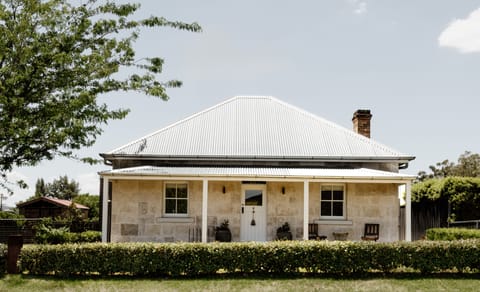 A classic stone façade introduces the home’s nostalgic country character at first glance.