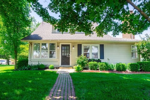 Home access is through the front door facing the road.