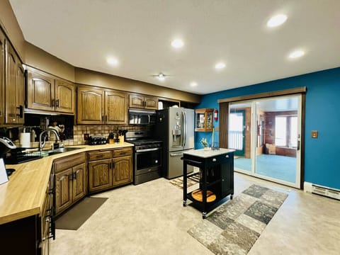 Fully equipped kitchen with modern appliances and plenty of space to cook together