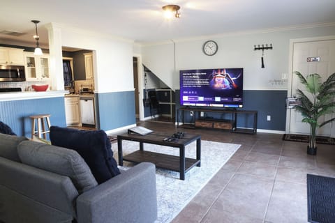 Entertainment area with 75” Smart TV, Roku, Fire TV, and retro games.