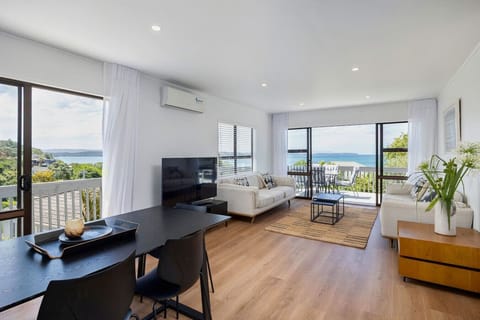 Upstairs living area with sweeping views, dining, main kitchen, complete with air conditioning and Smart TV