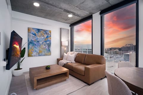 Luxury living room on the 8th floor with amazing views of downtown and mountains. Local original art and a 65” Roku tv.