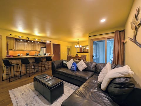 Sink into soft leather seating while your group prepares meals in the open kitchen, creating perfect moments together.