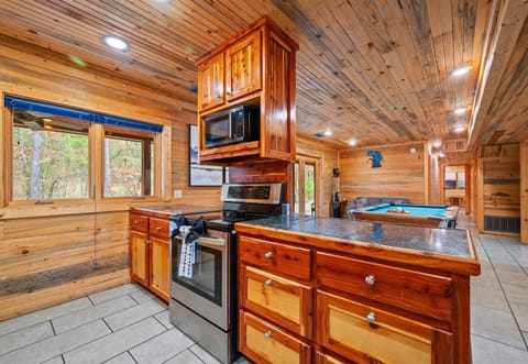 With ample counter space and storage, the kitchen is well equipped for preparing meals for large groups.