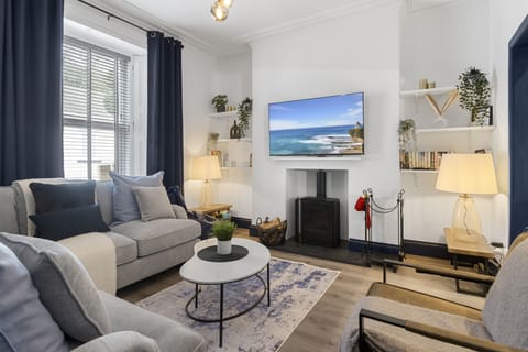 Cosy up in front of the log burner in the comfortable lounge