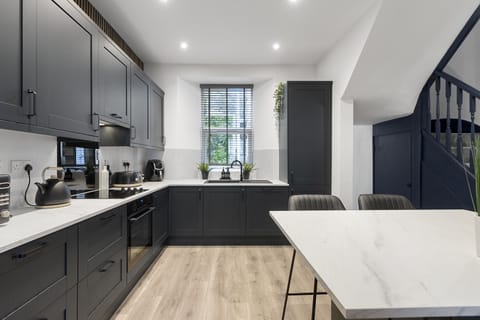 Cook up a storm in the fully equipped, modern kitchen with breakfast bar