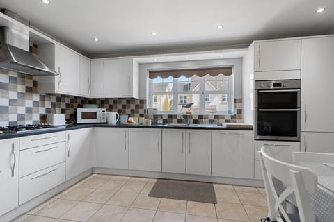 Cook up a storm in the fully equipped kitchen complete with dining table for 6