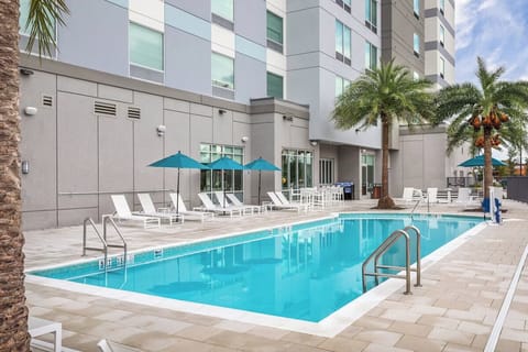 Unwind poolside with sparkling water and plenty of loungers.