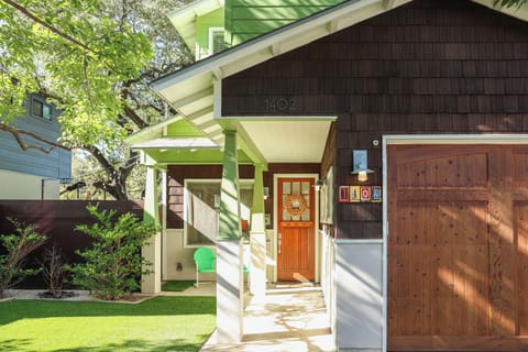 This charming craftsman-style entry, accented with classic wood shingle details, sets a warm welcome into this distinctive vacation rental home.