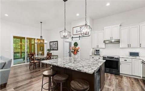 Oversized island with seating and easy access to the dining area.