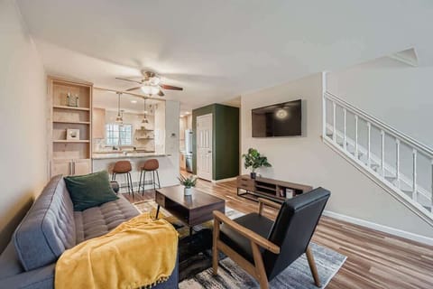 Step in through the front door to an open-concept kitchen, living room, and dining area.