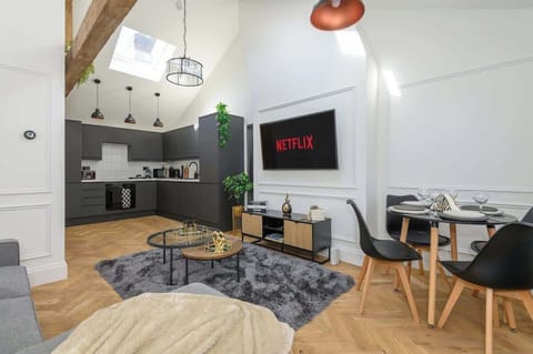 Living room  with Smart TV and dining table 