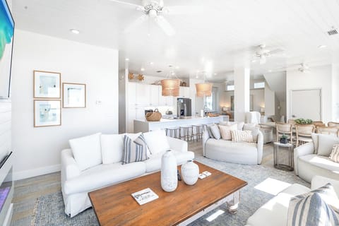 One of many generous living spaces, with amazing Gulf views and ample seating among thoughtful amenities that provide a refined, fun and welcoming home away from home..