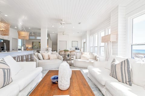 One of many generous living spaces, with amazing Gulf views and ample seating among thoughtful amenities that provide a refined, fun and welcoming home away from home..