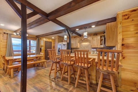 Step into your rustic mountain retreat framing the perfect gathering space for memorable meals with loved ones.