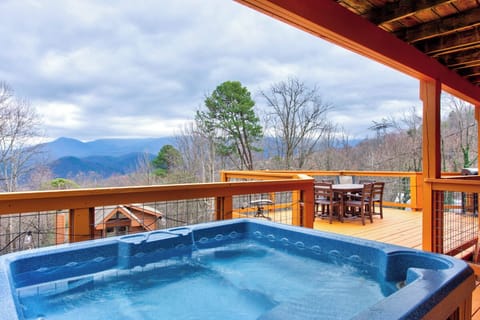 Soak in your bubbling hot tub while gazing at breathtaking mountain views from your covered deck.