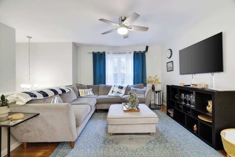 Living Room: Bright and airy space perfect for relaxation and game nights with loved ones!