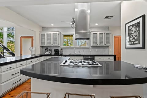 Chef's Kitchen with Gas Stovetop, Double Ovens, Microwave, Ice Maker  and Full Refrigerator