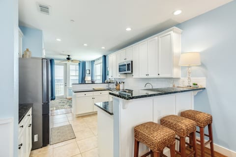 Nearby breakfast bar sits up to 3 more