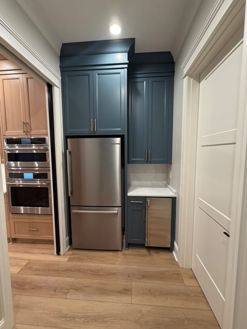 Pantry/Laundry Room.  Second refrigerator and stand alone ice maker. 