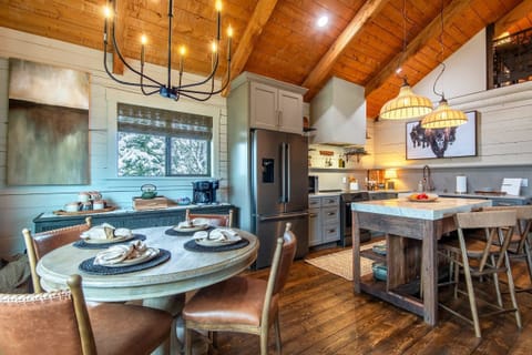 Enough dining space to seat 6 comfortably - 4 at the table and 2 at the counter.