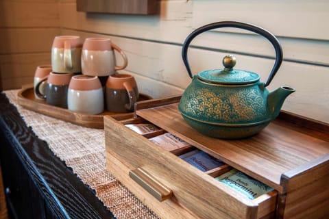 Tea, mugs, and space to pause. Perfect for a quiet moment in the morning or a wind-down at night.