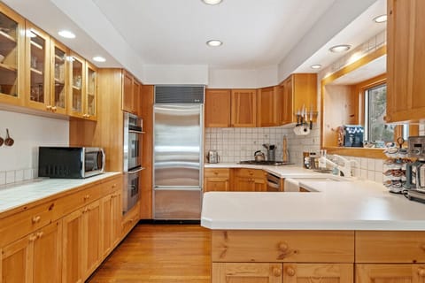 A charming kitchen setup with forest views